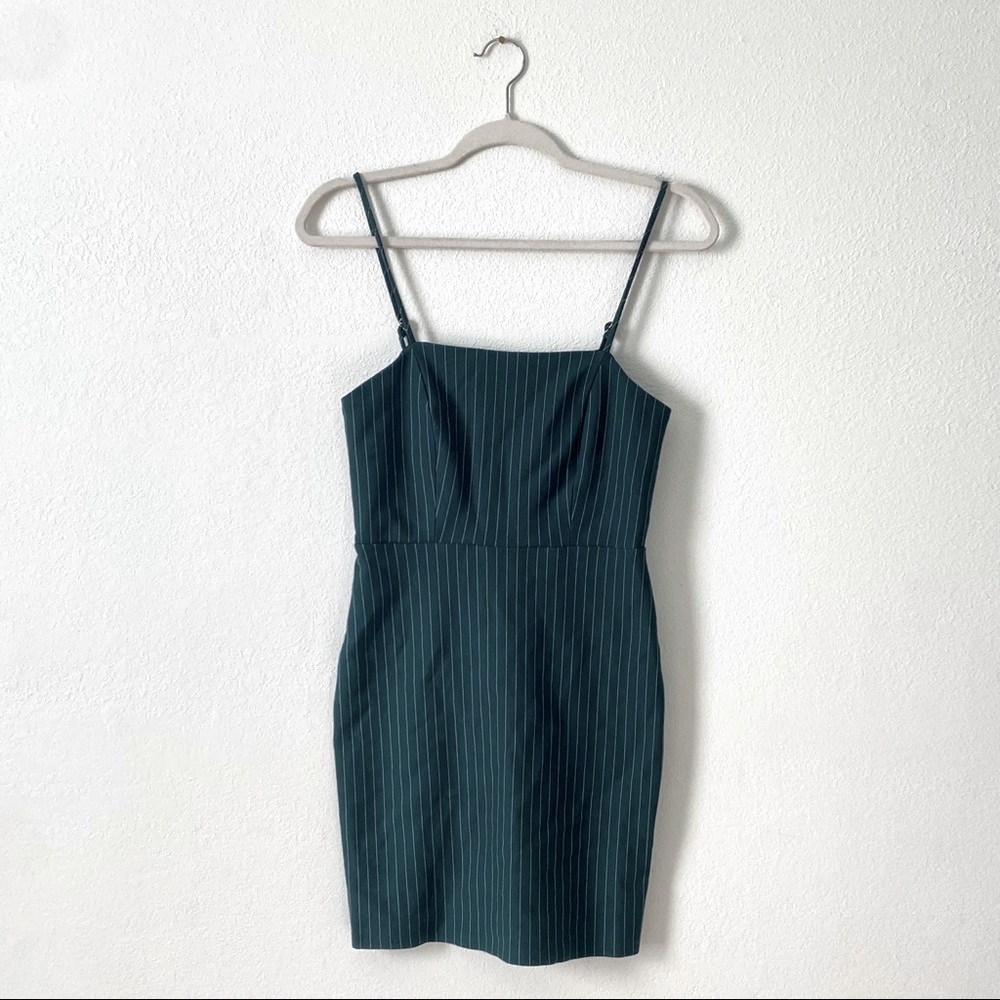 Woman’s body con spaghetti strap green striped dress